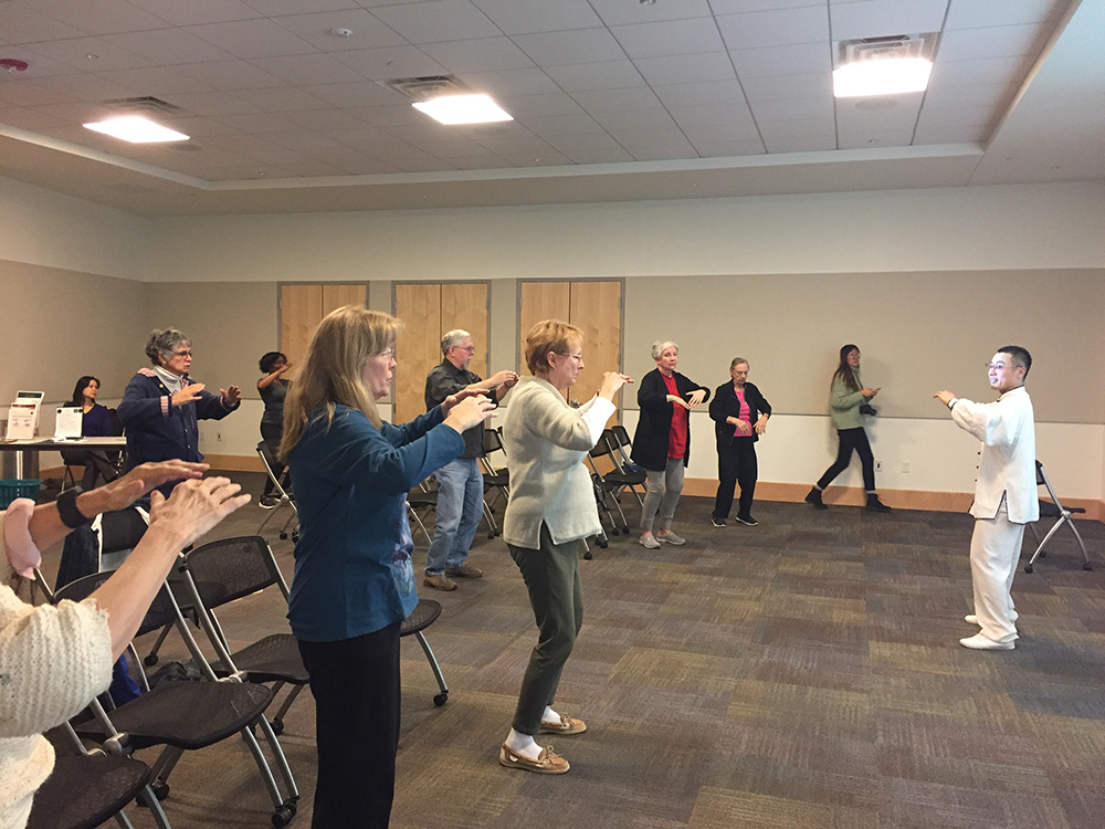 3. Xiusen Pan is teaching the community members the basic movements of Tachi 3. Xiusen Pan is teaching the community members the basic movements of Tachi