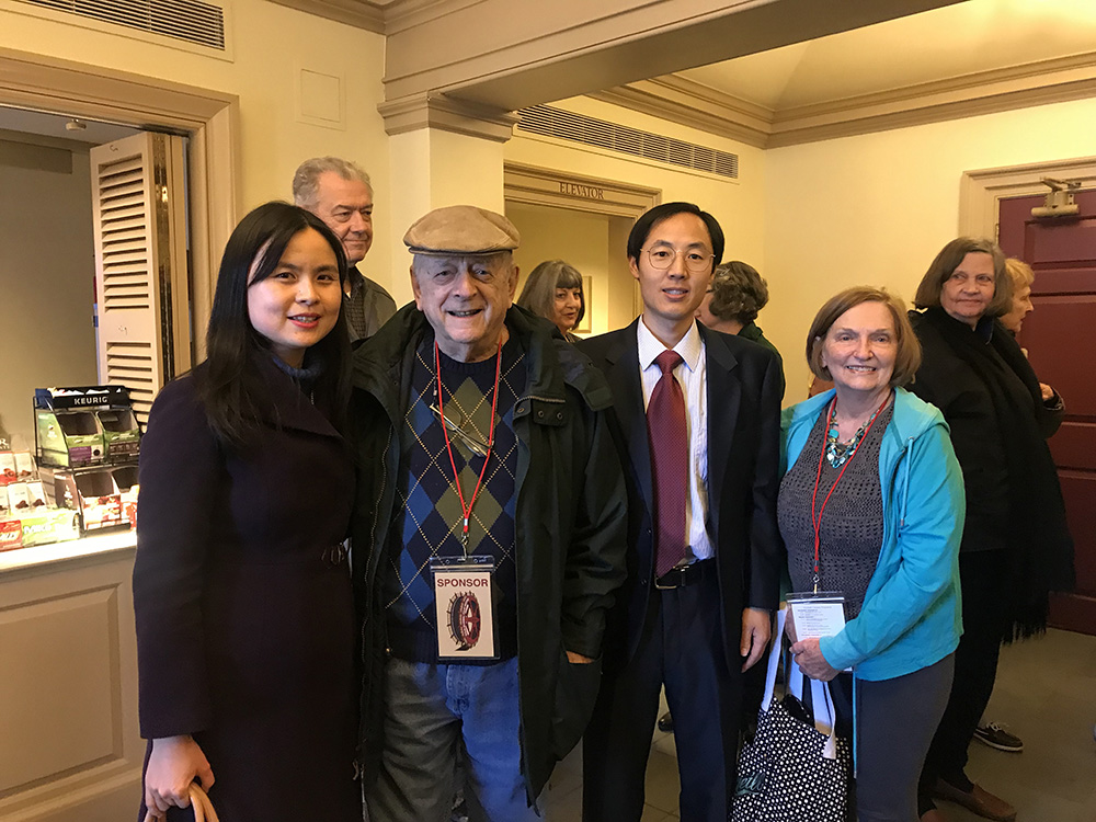 1. Chinese Director Deliang Wang and Associate Director Ying Liu take a picture with audience members 1. Chinese Director Deliang Wang and Associate Director Ying Liu take a picture with audience members